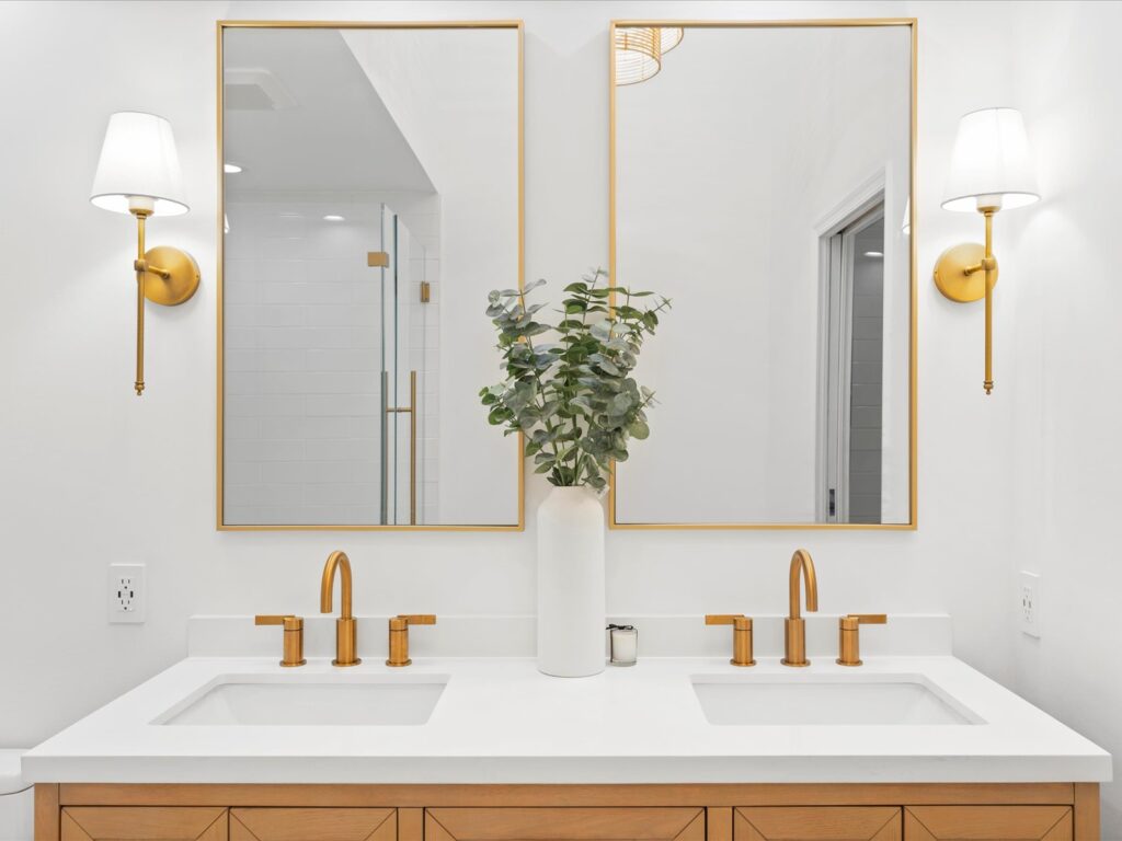 Bathroom remodel with twin sinks and mirrors