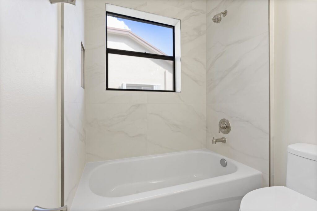 Bathtub and marble walls