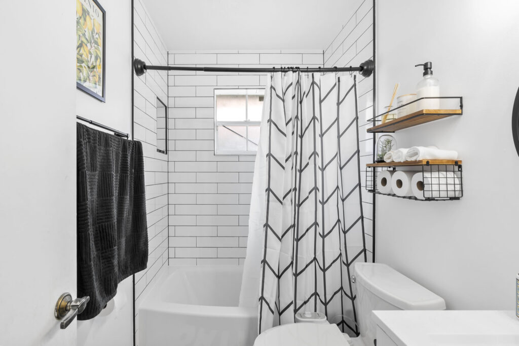 Black and white tile bathroom remodel.